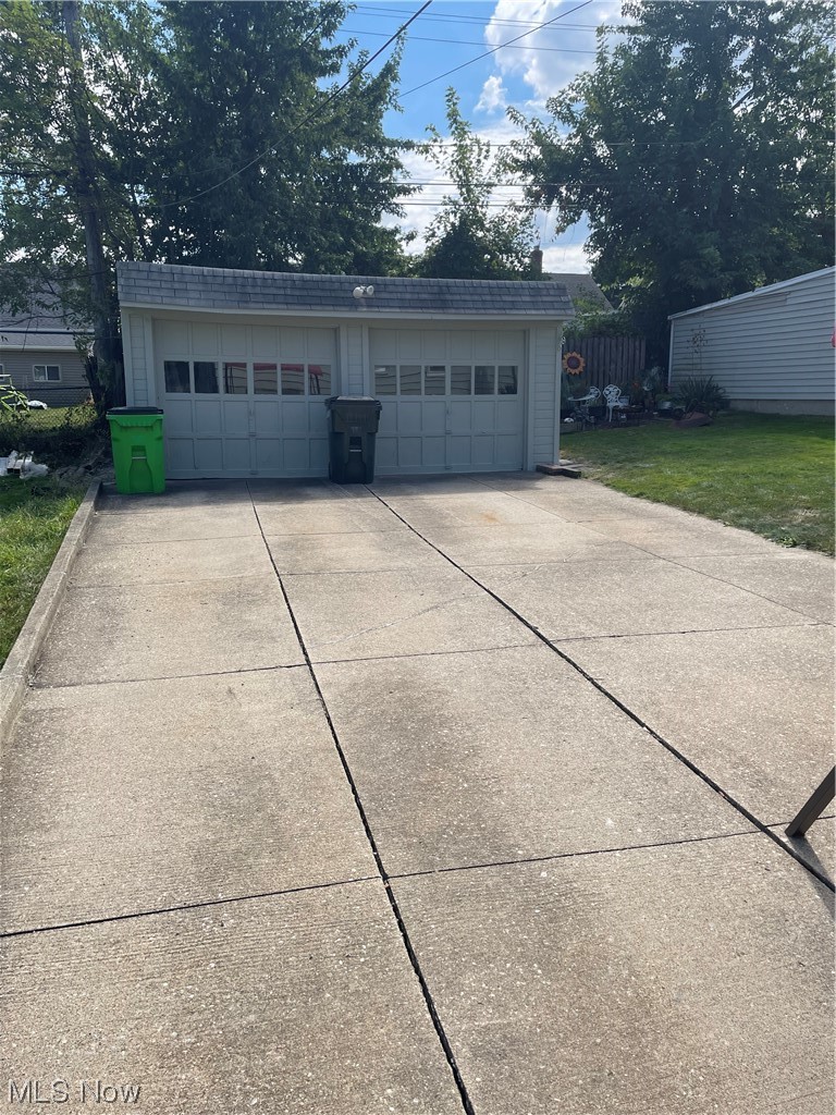 11610 Crofton Road Garfield Heights, OH 44125 - Photo 19 of 19 View of front of home featuring garage and a front lawn