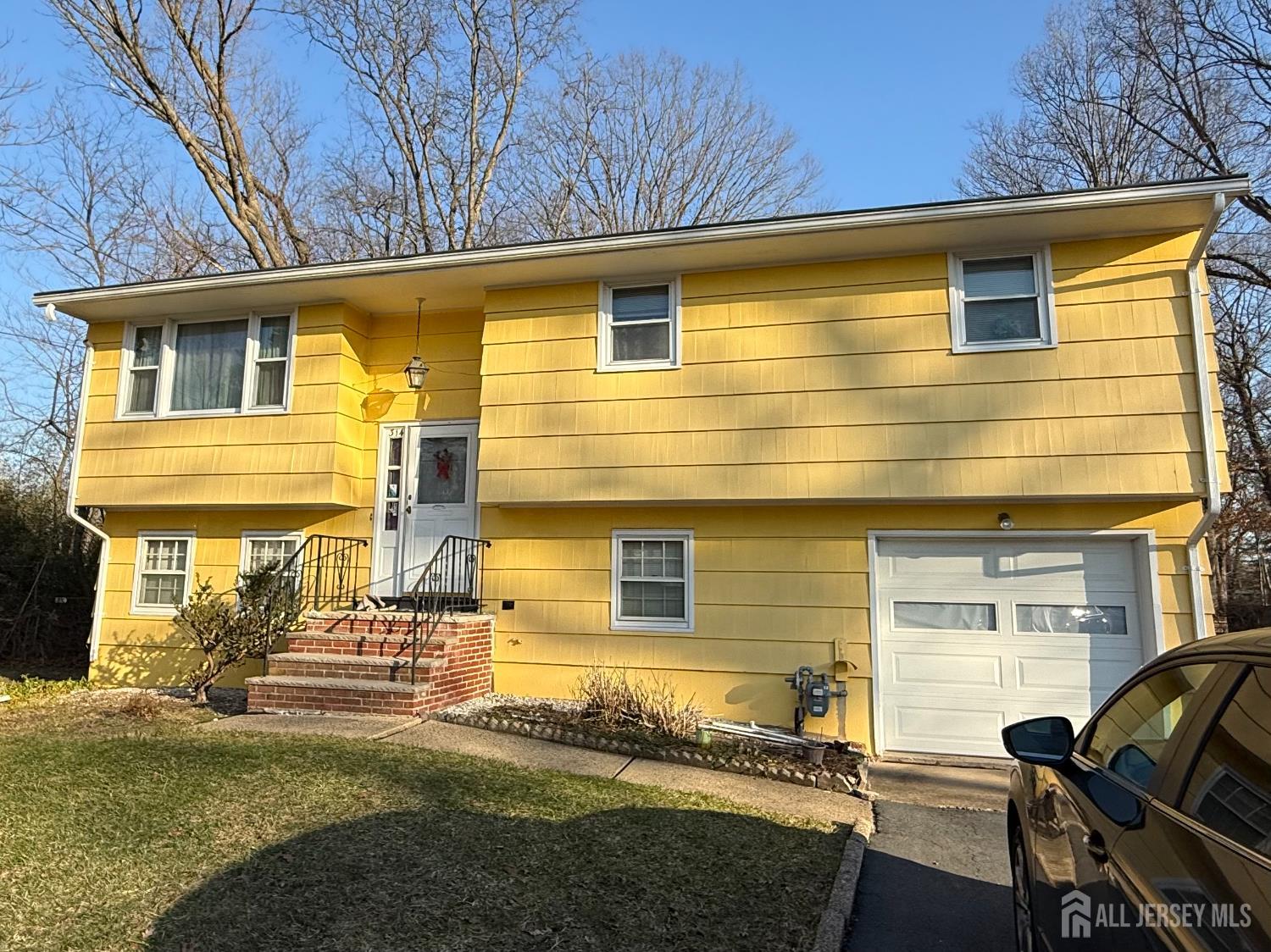 314 8th Street Piscataway, NJ 08854 - Photo 1 of 1 a front view of a house with a yard