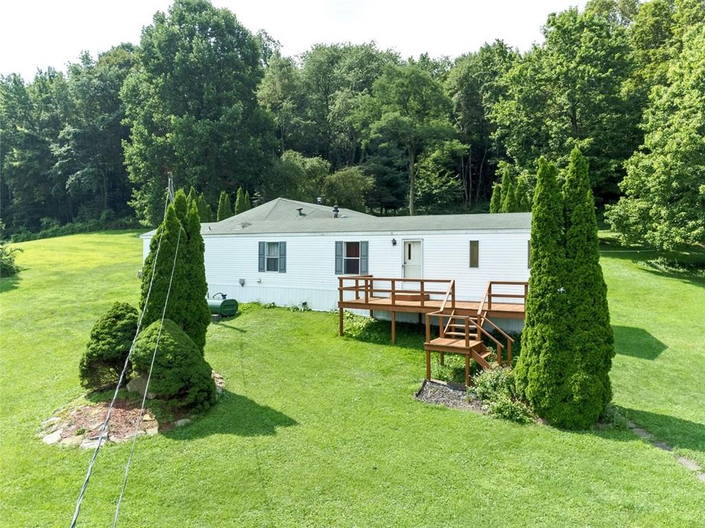 423 Quail Hill Road Normalville, PA 15469 - Photo 2 of 28 a aerial view of a house with pool and a yard