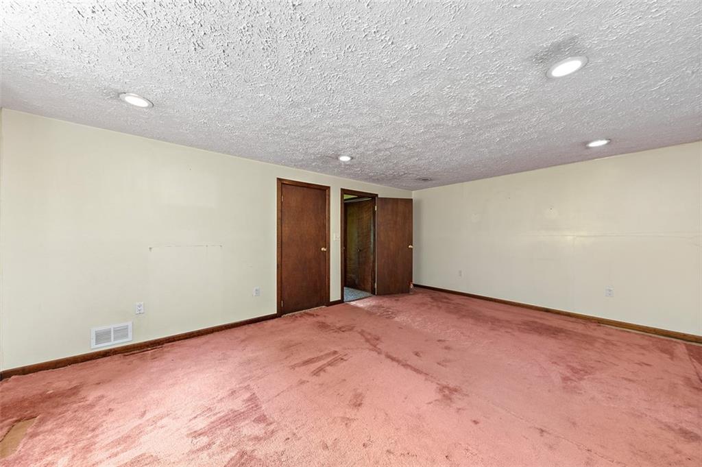 423 Quail Hill Road Normalville, PA 15469 - Photo 23 of 28 a view of an empty room with wooden floor