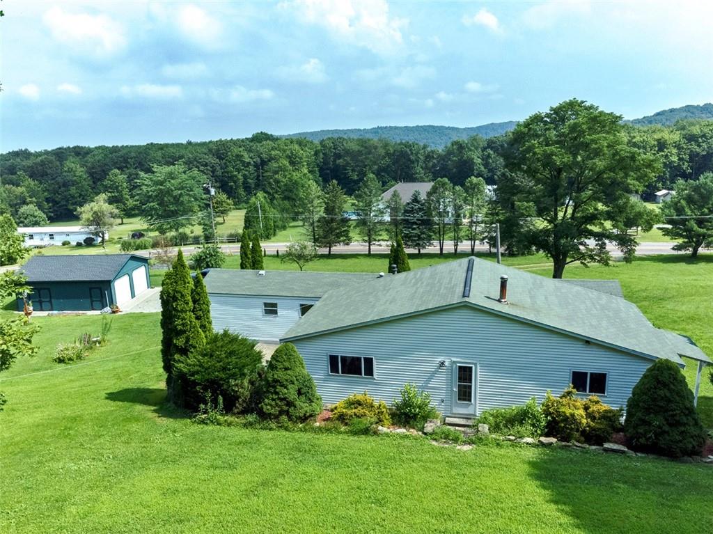 423 Quail Hill Road Normalville, PA 15469 - Photo 4 of 28 a aerial view of a house with table and chairs
