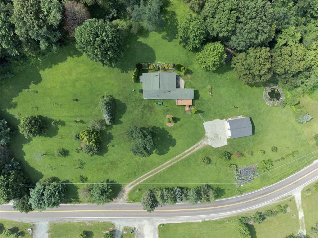 423 Quail Hill Road Normalville, PA 15469 - Photo 5 of 28 an aerial view of a residential houses with outdoor space and trees all around