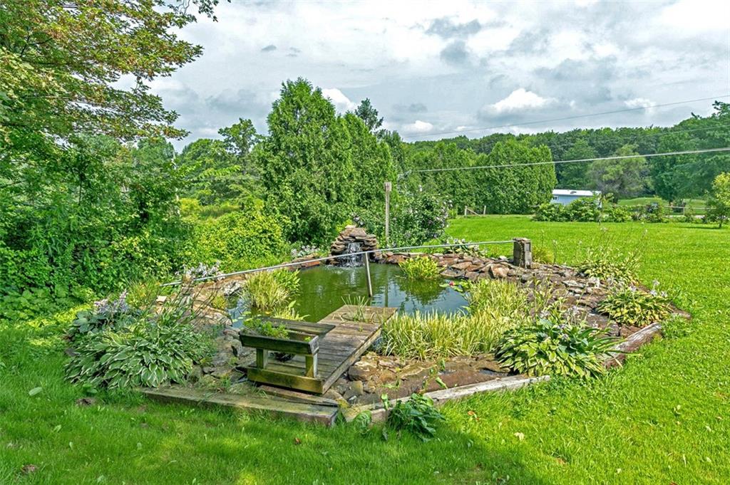 423 Quail Hill Road Normalville, PA 15469 - Photo 7 of 28 a view of a lake with a yard