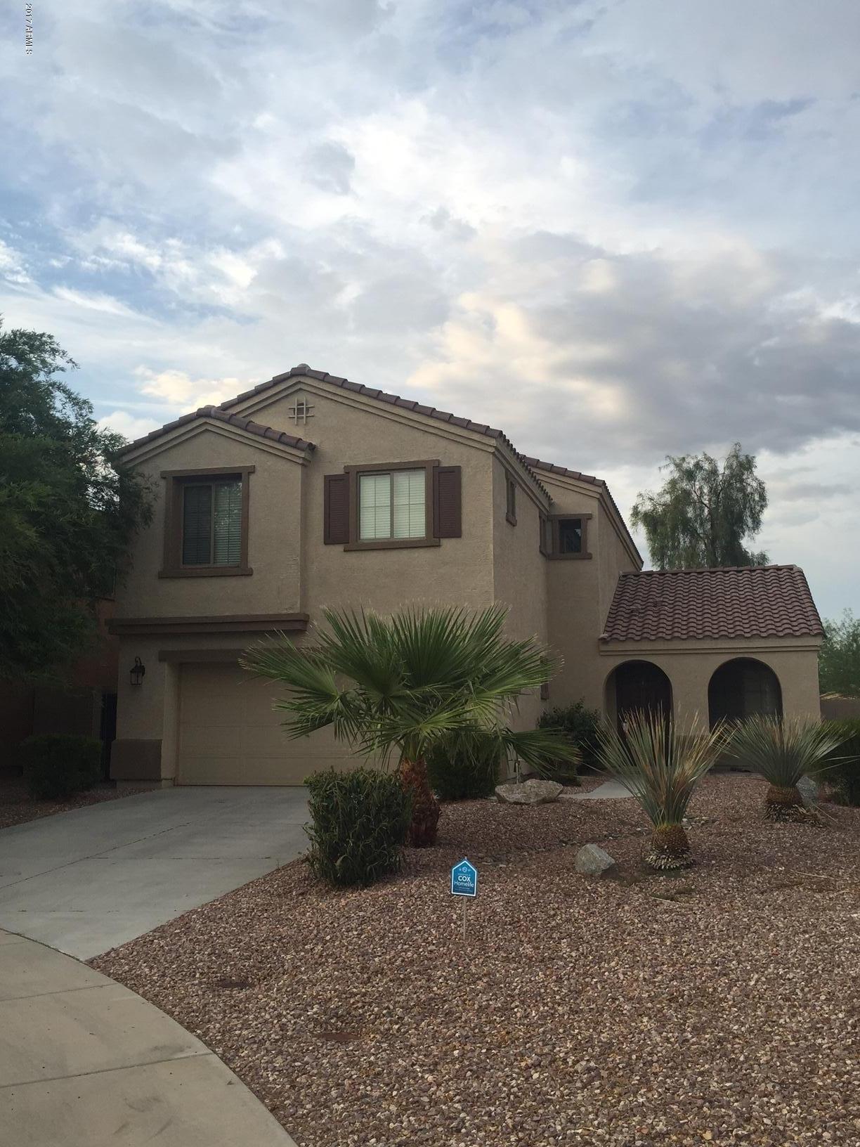 17544 West Hearn Road Surprise, AZ 85388 - Photo 2 of 17 a front view of a house with garden