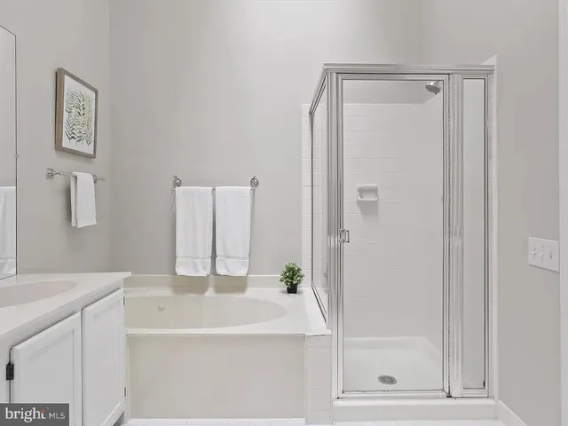 a bathroom with a bathtub and a sink