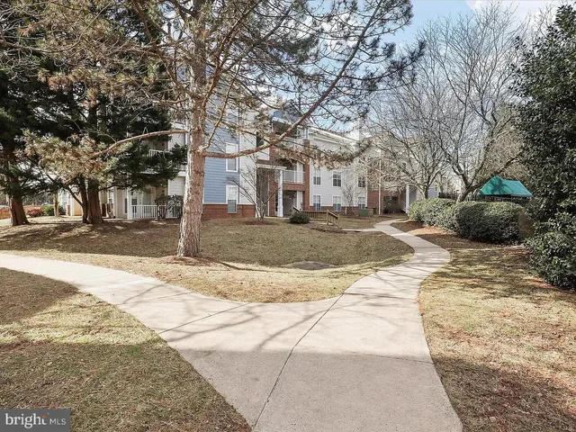 a picture of a bench in front of a wall