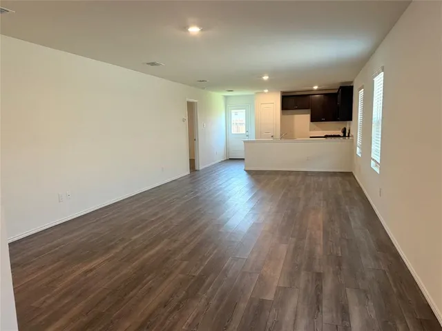 a view of a kitchen with a sink and cabinets
