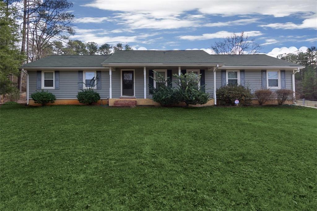 787 Ralph Road Southeast Conyers, GA 30094 - Photo 1 of 1 front view of a brick house with a yard