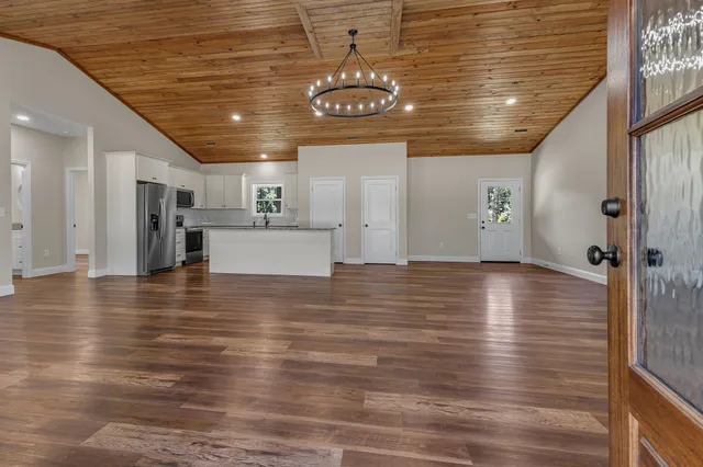 a view of a kitchen with a table and chairs