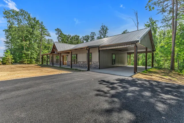 a view of a house with backyard and porch