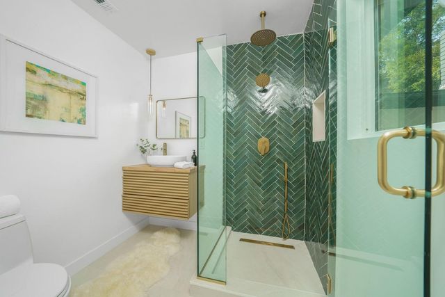 a view of a house with a yard and a patio