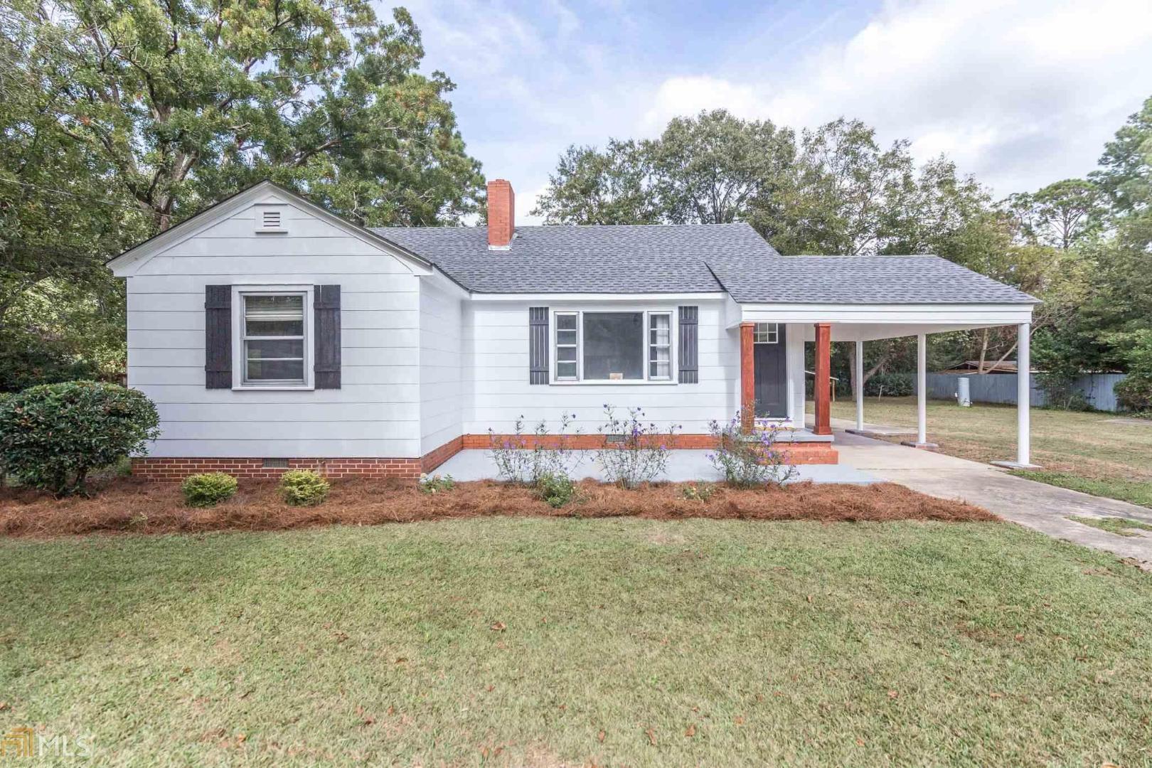 1607 Highland Avenue Dublin, GA 31021 - Photo 1 of 1 front view of a house with a yard