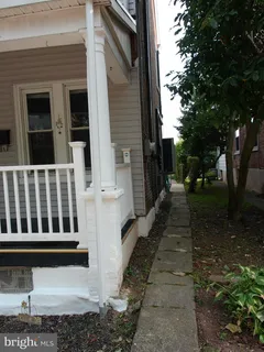 a backyard of a house with seating space