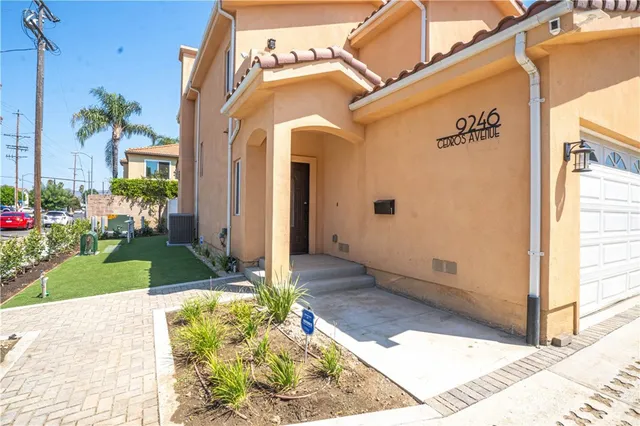 a view of a front door and small yard