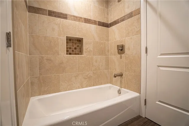 a bathroom with a white bath tub