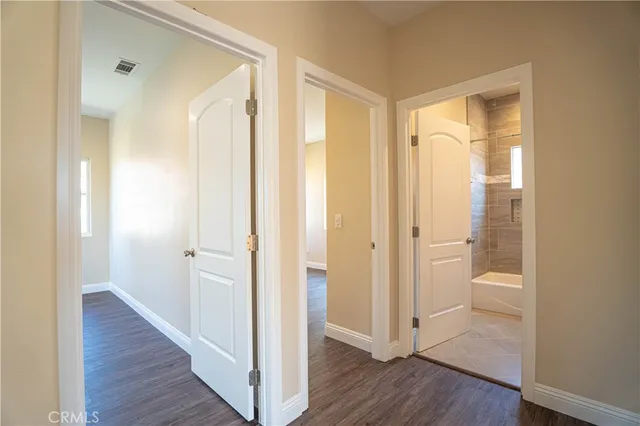a view of a bathroom with wooden floor
