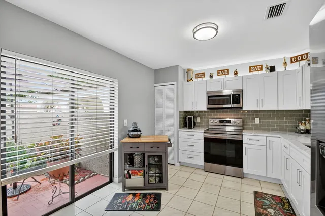 a kitchen with a sink a stove and refrigerator