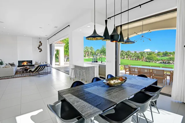 a room with pool table and windows