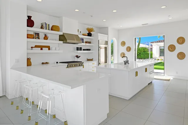 a kitchen that has a cabinets and a stove in it