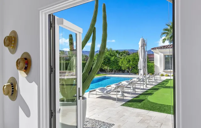 a kitchen with stainless steel appliances a stove sink and microwave