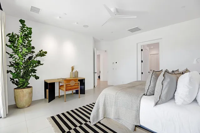 a bathroom with a tub a sink and a shower