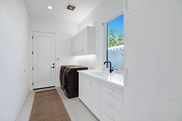 a view of a house with swimming pool and porch with furniture
