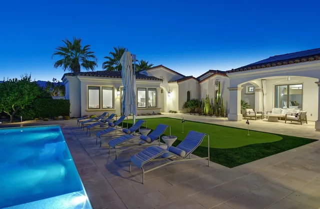 a view of a table and chairs in the garden