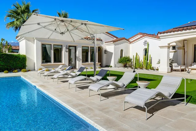 a view of patio with chairs and tables