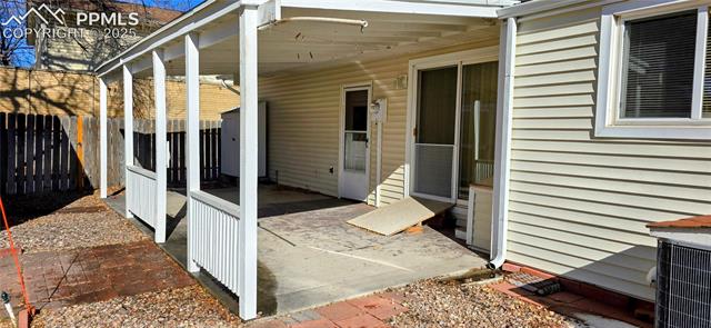 6313 Chippewa Road Colorado Springs, CO 80915 - Photo 9 of 36 View of patio / terrace featuring central AC unit