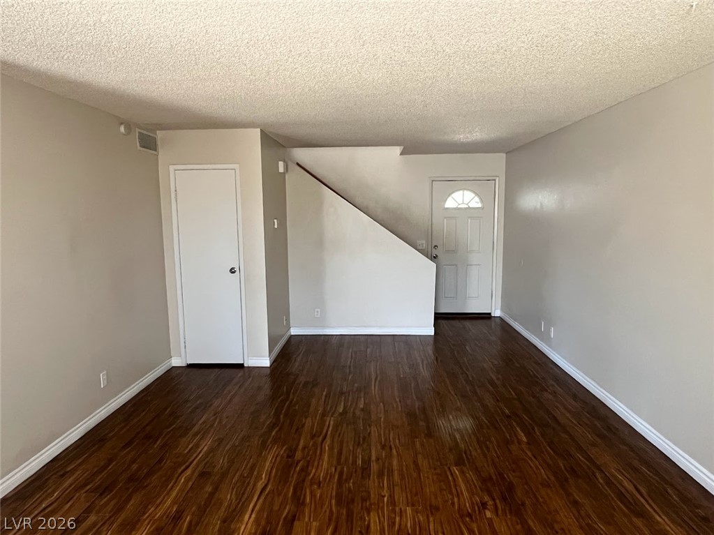 914 Scarlet Ridge Drive Las Vegas, NV 89128 - Photo 4 of 25 Rich hardwood-style flooring extends throughout this adaptable main living space.
