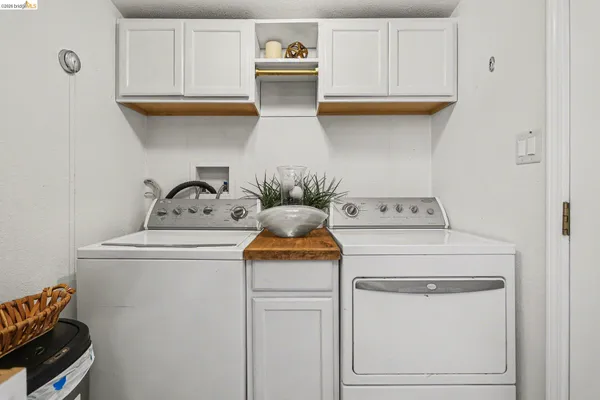 a kitchen with stainless steel appliances kitchen island granite countertop a sink a stove and a wooden floors