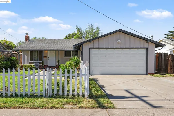 a front view of house with a yard