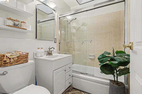 a bedroom with a large bed and a large window