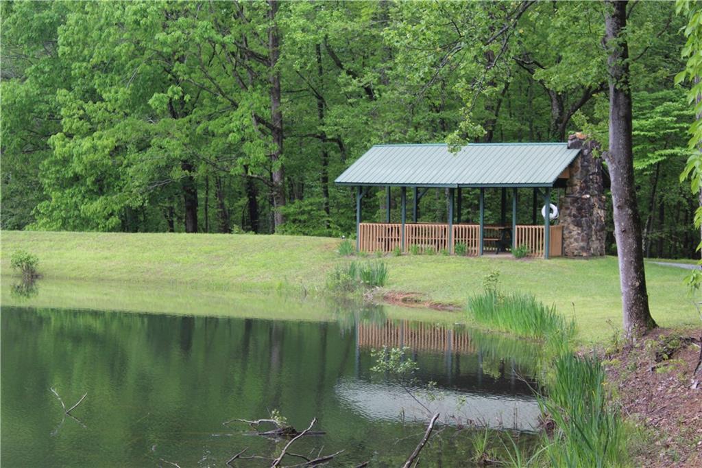 Lot 19 Owl Mountain Road Ellijay, GA 30536 - Photo 22 of 25 a view of a fountain in front of a house with a big yard