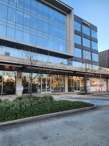 a front view of a building with an outdoor space