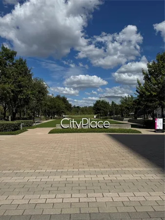 a view of a street with a building in the background