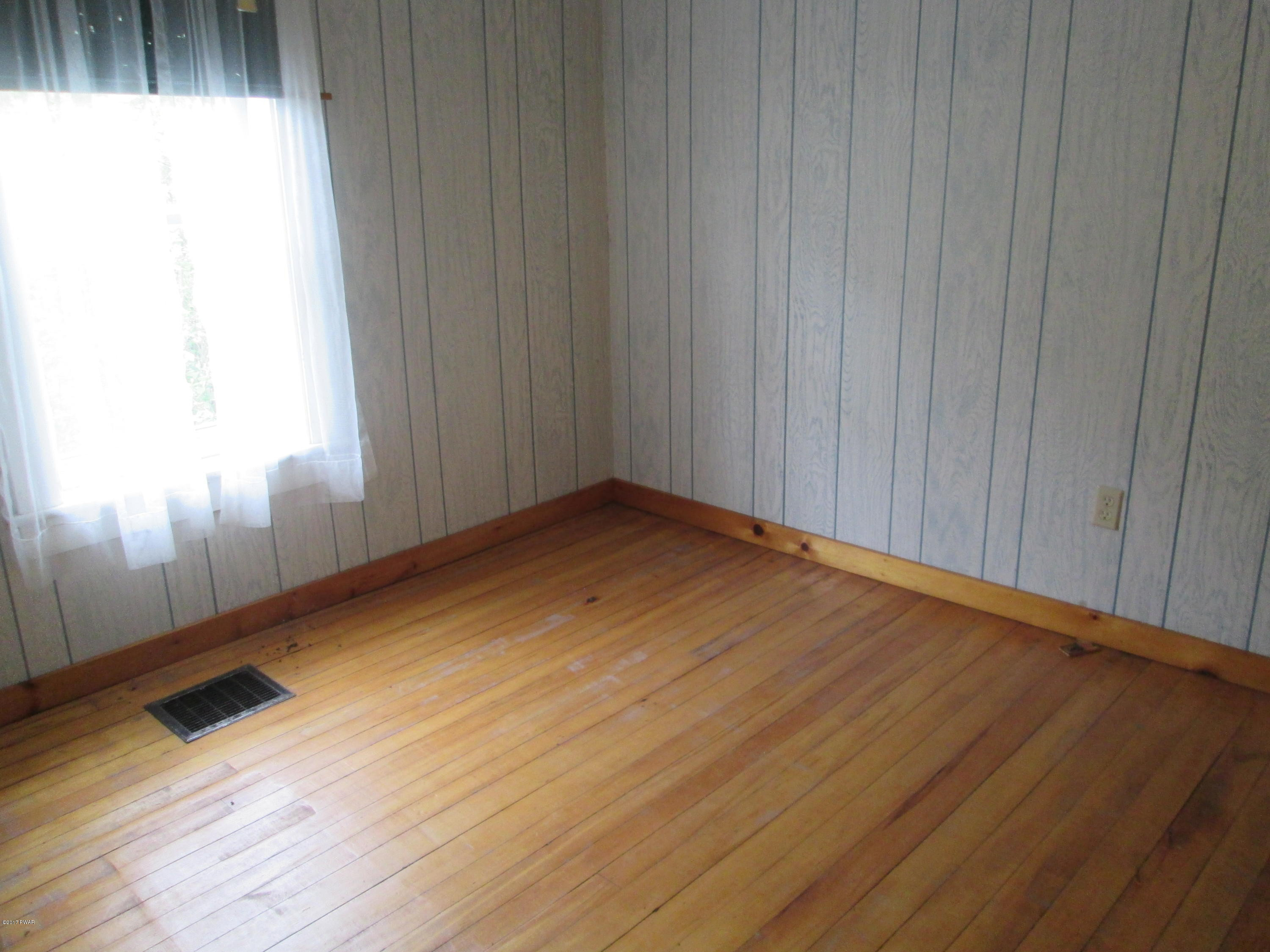 86 Beaver Hollow Road Lakewood, PA 18439 - Photo 16 of 30 a view of a room with wooden floor