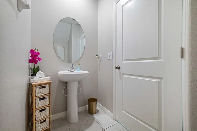 a white toilet sitting next to a white cabinet
