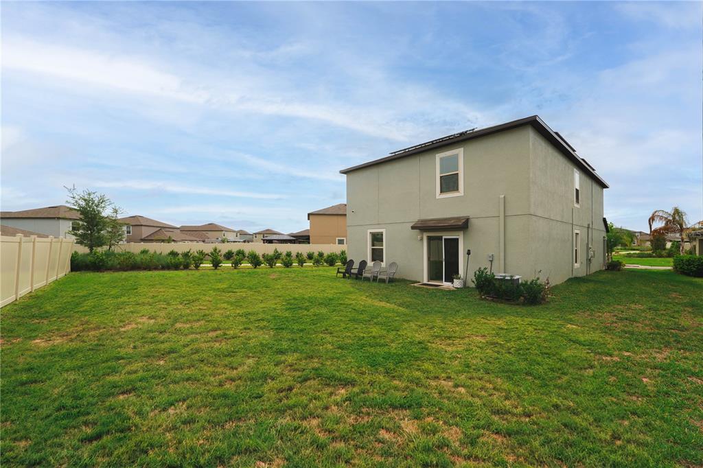9448 Lemon Drop Loop Ruskin, FL 33573 - Photo 20 of 28 a view of a backyard