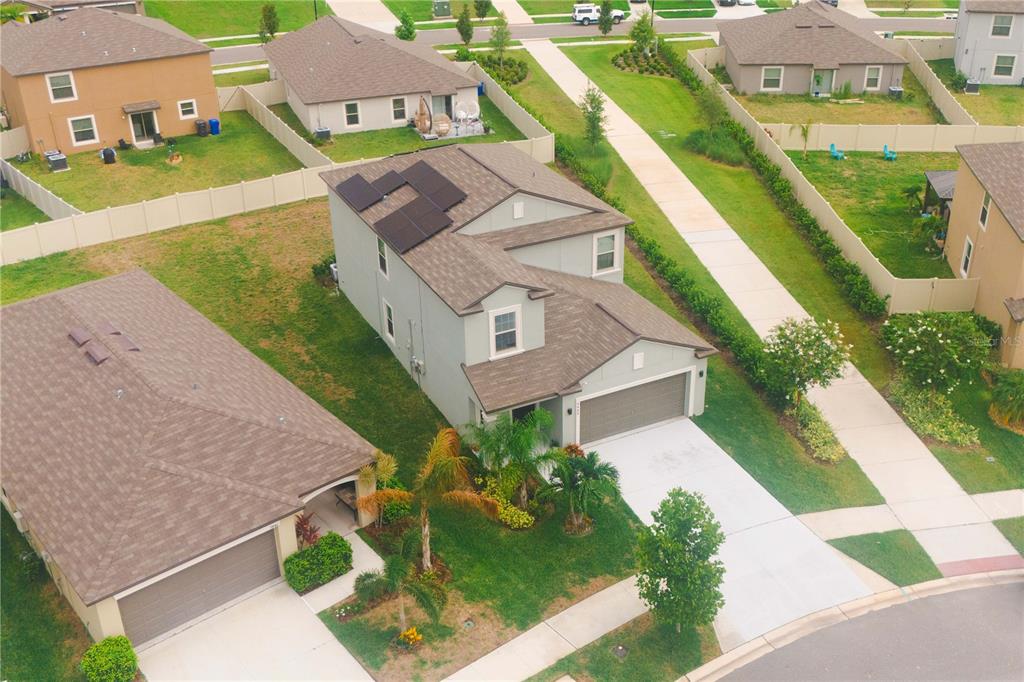 9448 Lemon Drop Loop Ruskin, FL 33573 - Photo 22 of 28 an aerial view of a house with a yard