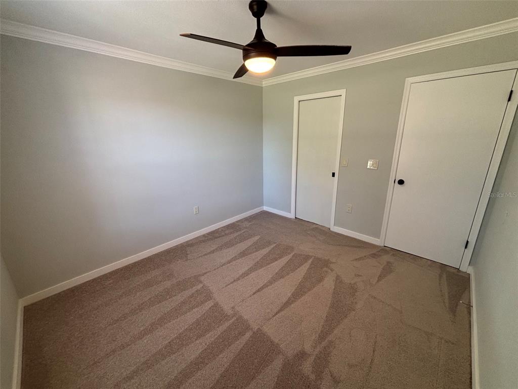 9801 Southeast Sunset Harbor Road Summerfield, FL 34491 - Photo 14 of 37 a view of an empty room