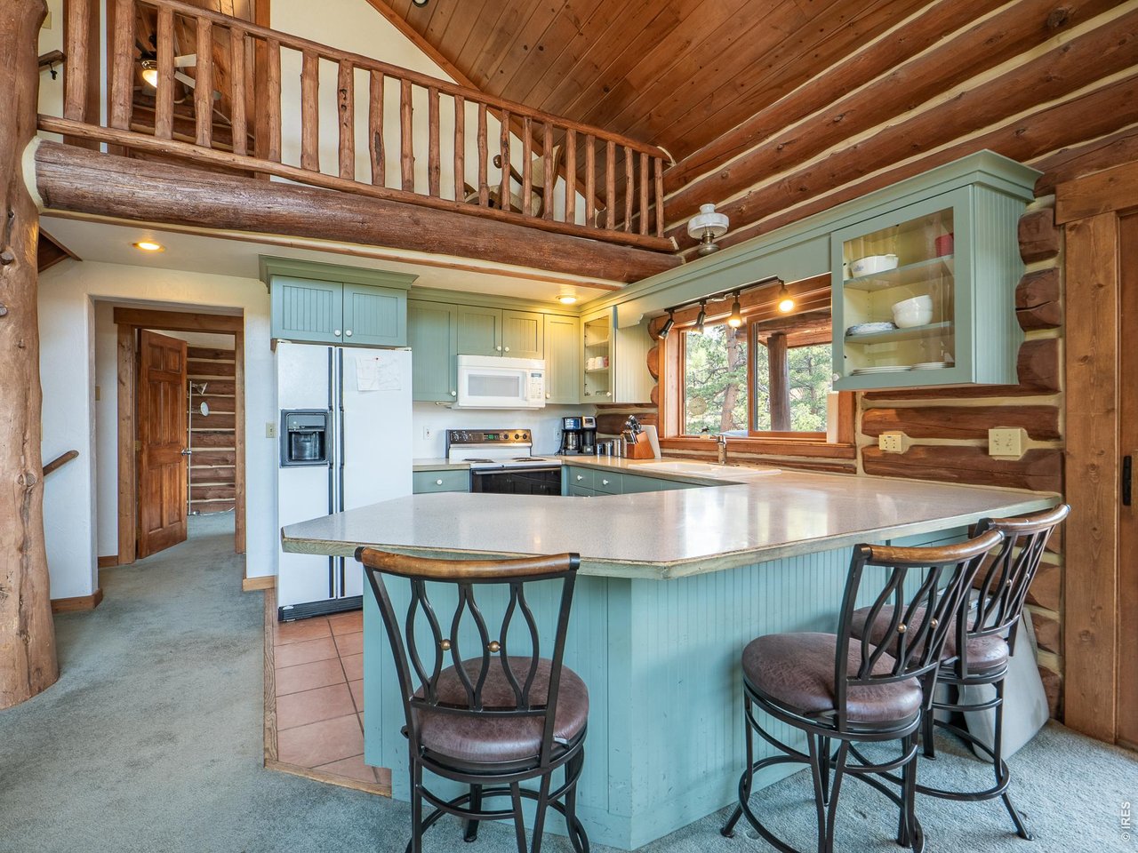 296 Caddo Road Red Feather Lakes, CO 80545 - Photo 8 of 50 Breakfast bar peninsula.