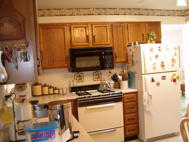 6037 Running Valley Road Stroudsburg, PA 18360 - Photo 8 of 10 a kitchen with a refrigerator and a stove top oven