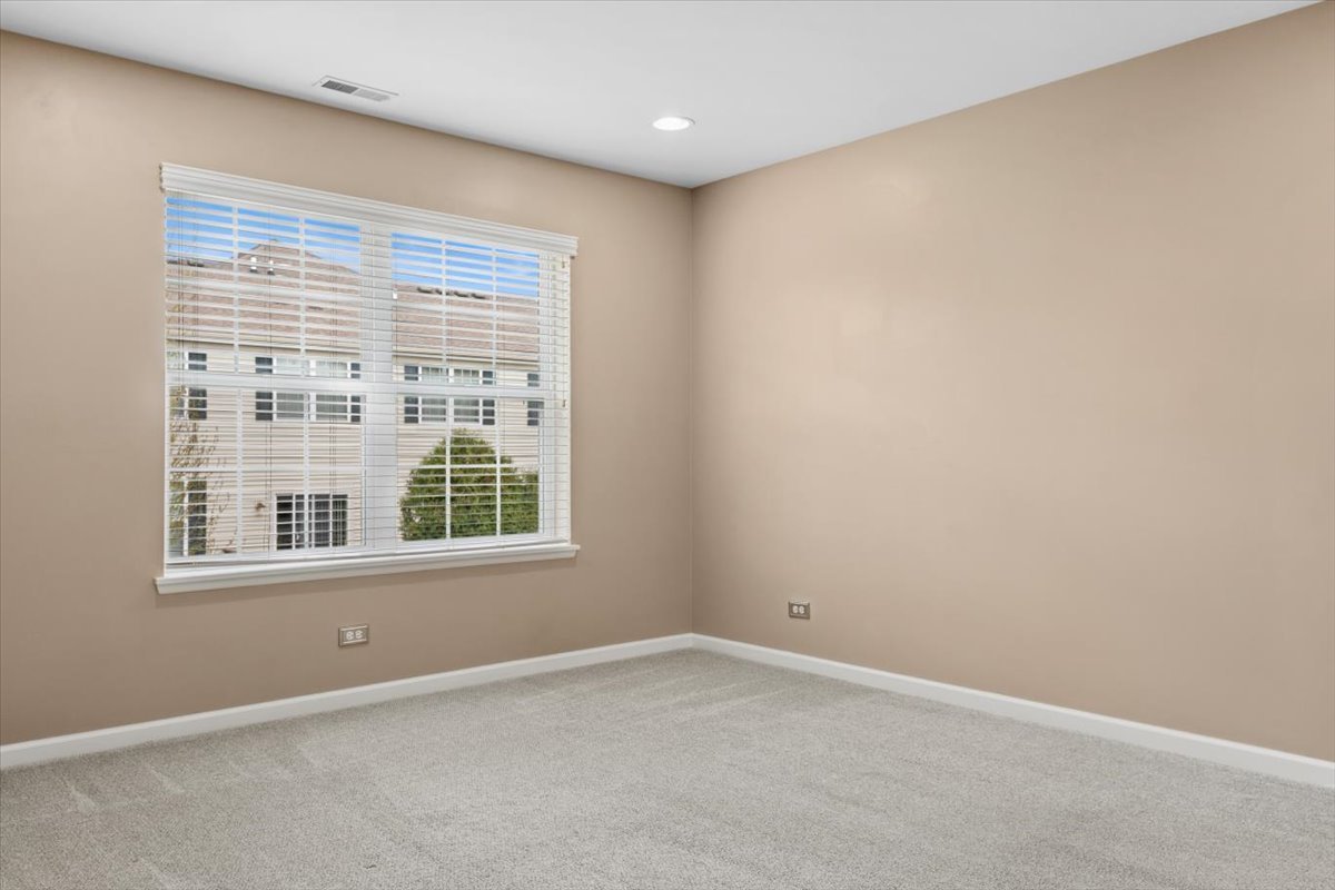 9965 Cummings Street Huntley, IL 60142 - Photo 12 of 23 an empty room with a window
