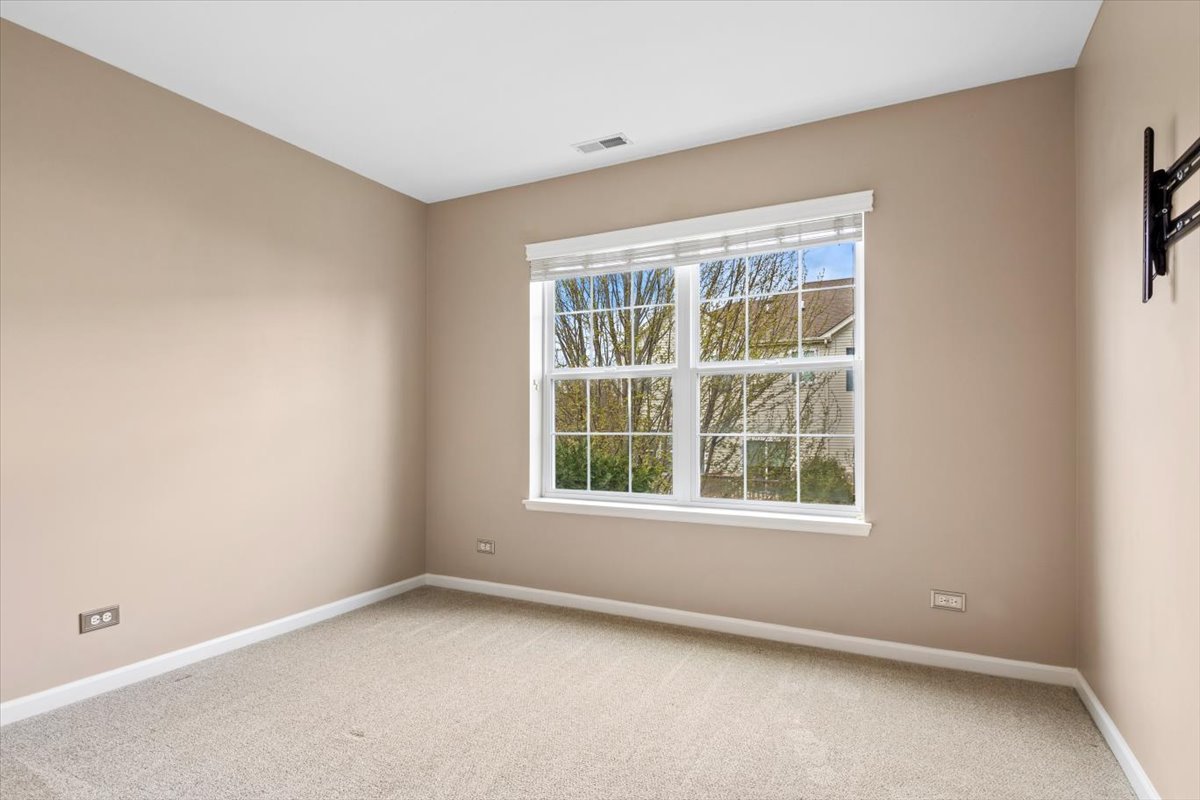 9965 Cummings Street Huntley, IL 60142 - Photo 13 of 23 an empty room with a window