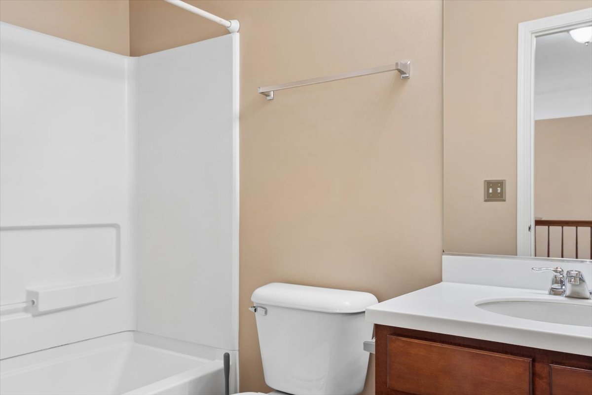 9965 Cummings Street Huntley, IL 60142 - Photo 14 of 23 a bathroom with a sink a toilet and shower
