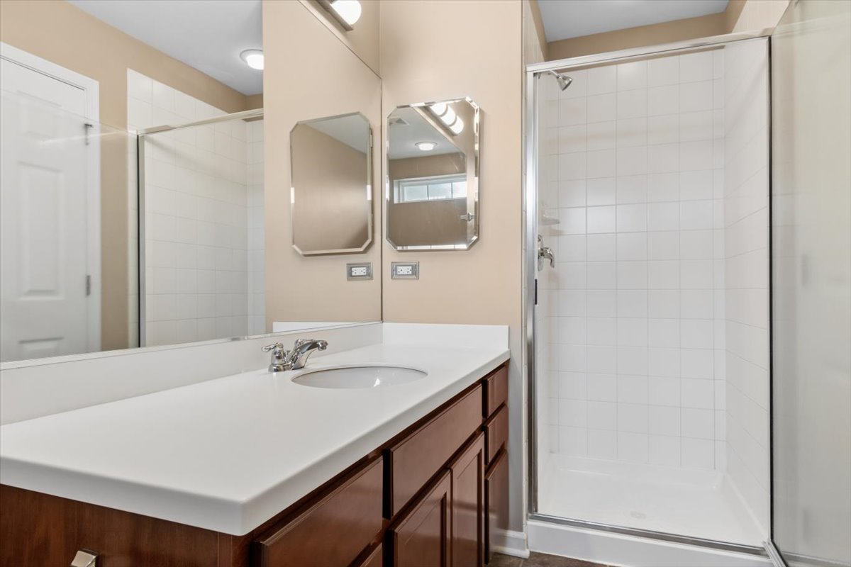 9965 Cummings Street Huntley, IL 60142 - Photo 19 of 23 a bathroom with a sink and a mirror
