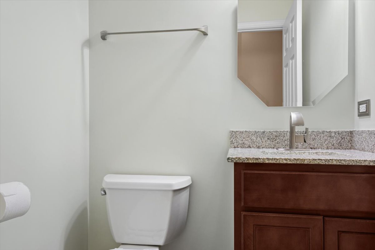 9965 Cummings Street Huntley, IL 60142 - Photo 8 of 23 a bathroom with a granite countertop sink and a toilet