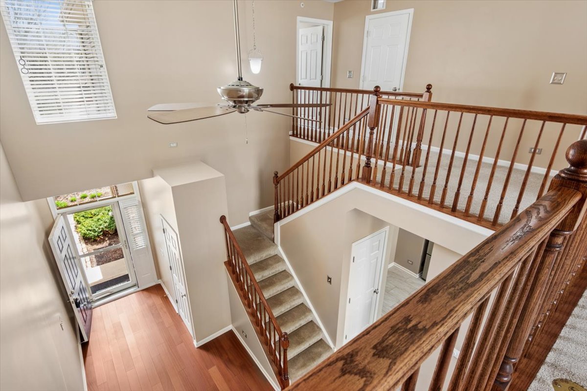 9965 Cummings Street Huntley, IL 60142 - Photo 10 of 23 a view of stairs and furniture