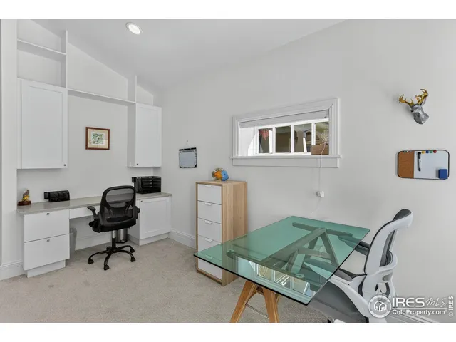 a view of a workspace with furniture